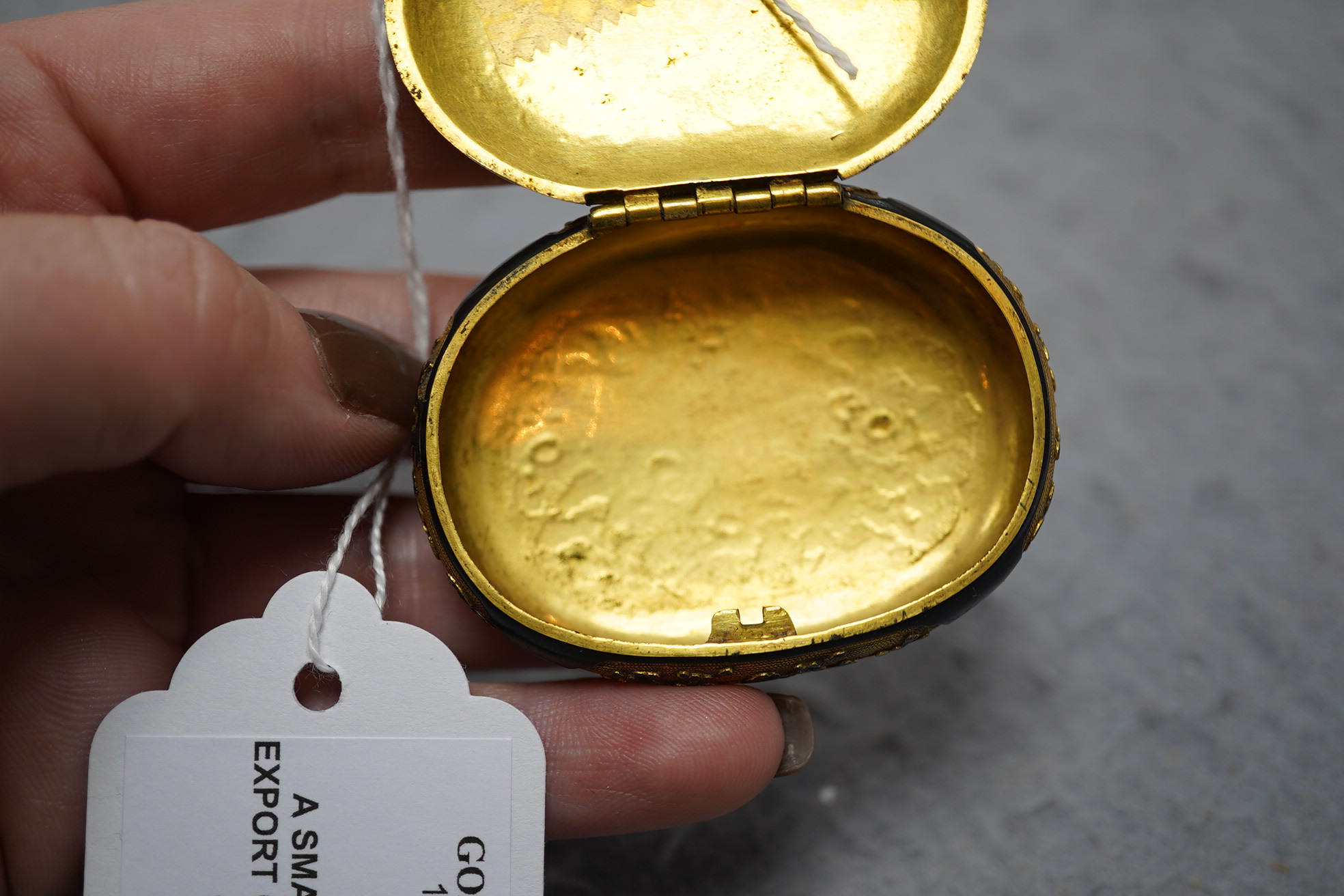 A small Japanese export gilt bronze Sawasa oval tobacco box, 18th century